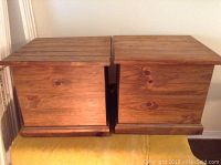 Two pine wood cube storage boxes side by side, showing the front and top surfaces.