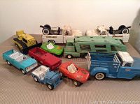Overview of all vehicles arranged on table under light background