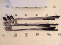 Full view of the golf club set laid out showing shafts, grips, and heads, highlighting length and type of clubs.