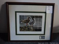 Full view of the framed print showing two mallard ducks by Robert Bateman with an edition number and signature below the image.