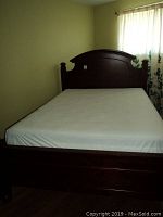 Front view of assembled bed frame and mattress