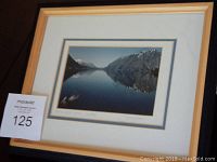 Framed photo of Kathleen Lake, Yukon showing the lake and mountain reflection, the frame has tape on back.