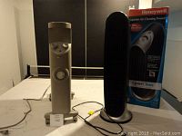 Front view of Bionaire radiant heater and Honeywell QuietClean air purifier with original box showing both items in the lot.