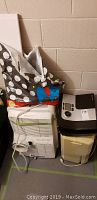 Three appliances shown together; the Bionaire humidifier, Fedders dehumidifier with visible front damage, and a Frigidaire air conditioner with a vent.