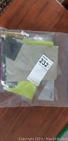 Plastic bag with folded aged military papers and documents, with auction label attached.