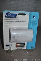 Front view of packaged Garrison carbon monoxide alarm, includes Duracell 9V battery and product information.