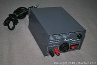 Front angled view of the Samlex regulated DC power supply showing output terminals and power cord.