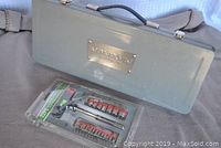 Gray metal Mastercraft Maximum socket set case and sealed Toolplus 22-piece T-handle socket and power bit set packaging.