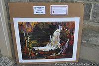 Photo showing the sealed print on cardboard backing with price label $299.00 and labels from Group of Seven Publishing.