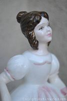 Close-up view of the Amanda figurine's head and upper torso showing detailed painted facial features and hair in bun style.