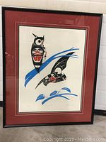 Full view of the framed print showing the artwork, matting, and framing details