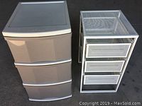 Photo of Blue Planet plastic storage tower and white metal mesh storage tower side by side, showing overall structure and dimensions.