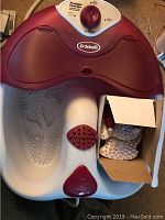 Dr. Scholls foot spa unit showing basin and control dial on top with brand label visible