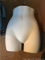 Bottom half torso mannequin shown from front, highlighting overall condition and shape