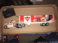 Remote control Canadian Tire transport truck and wireless controller in cardboard box
