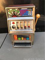 Full front view of the vintage Waco Casino King slot machine showing the reels, coin slot, payout instructions, and handle.