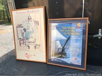 Framed Norman Rockwell and Tall Ships Kingston posters together on display.