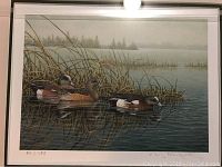 Close-up of the numbered limited edition print showing three ducks on water near marsh grasses, marked 80/750.