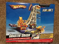 Front view of Hot Wheels Coaster Crash box showing play set and included cars