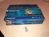 Polaroid DVD Player DVP-1000 box overview with blue packaging and branding