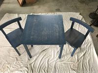 Set of IKEA SORK kids table and two chairs on white sheet, top and side view