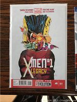 Front cover of X-Men Legacy #1 comic book with a colorful abstract face and red bottom banner.
