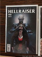 Cover of Clive Barker's Hellraiser Issue #9 showing a horror illustration of a figure with pins in the head and hands covering the face of another person
