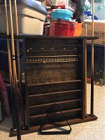 Full view of the pine pool cue and ball holder mounted with 5 pool cues, showing storage rods and score counter.