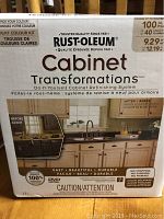 Front of the box showing Rust-Oleum Cabinet Transformations brand, light colour kit, do-it-yourself cabinet refinishing system, and before-after image demonstrating cabinet refinishing result in white.