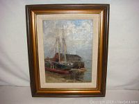 Full view of the original framed oil painting depicting sailboats tied to a dock with a distant shoreline under cloudy sky.