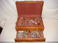 Photo showing the full open jewelry box with top tray and lower drawer visible, illustrating box dimensions and item quantity.