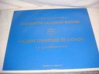 Blue portfolio cover with gold lettering in English and French.