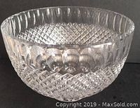 Clear Birks crystal bowl showing detailed texture and patterns on a dark background