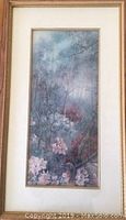 Framed and matted floral print showing full artwork and wooden frame with matting.
