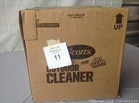 Closed cardboard box labeled Scotts Outdoor Cleaner, case of 6 bottles.