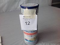 Photo of Dr Cohen's heatable deep tissue massager in cylindrical packaging showing brand and product information.