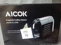 Photo of the Aicok Capsule Coffee Maker box showing front and product image.