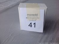 Sealed white box with MaxSold auction label number 41 covering top flap.