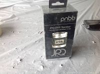 Front view of the PNBB JPQ-002 Bluetooth speaker box, showing model number and branding.