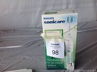 Front of the Philips Sonicare toothbrush box showing branding and features.