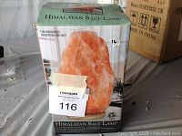 Boxed Himalayan salt lamp showing product image and label from front.