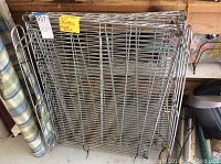 Folded wire shelves stacked horizontally showing wire grid and structure