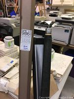 Side view showing the height sticker indicating 45 inches wide by 73 inches tall, with the Da-Lite label visible.