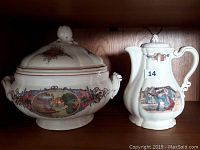 Photo showing antique French ceramic soup tureen with lid and matching coffee pot or pitcher with hand painted pastoral and floral scenes.