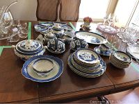 Overview of all blue and white china pieces including plates and serving items