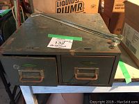 Vintage metal 2 drawer file cabinet with label holders and metal handles, showing top and front.