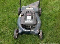 Top view of the mower showing the blade housing and engine cover with MTD labeling and 6 HP motor indication.
