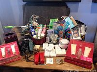 Full view of all items for sale including gift sets, soaps, clippers, laundry accessories on a wooden table.
