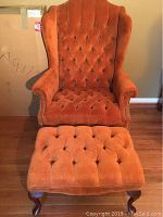 Front view of wingback chair with matching ottoman
