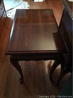 Top view of wooden tea table showing smooth polished surface and wood grain.